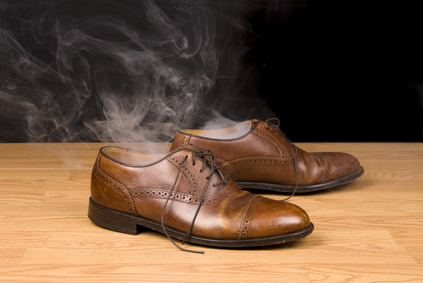 A pair of dress shoes steaming after a hot day of wear and tear. Image can also be used to infer someone has disappeared or vanashed from their shoes.
