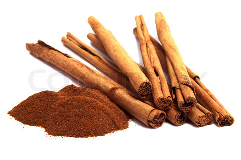 cinnamon powder and bark isolated on white